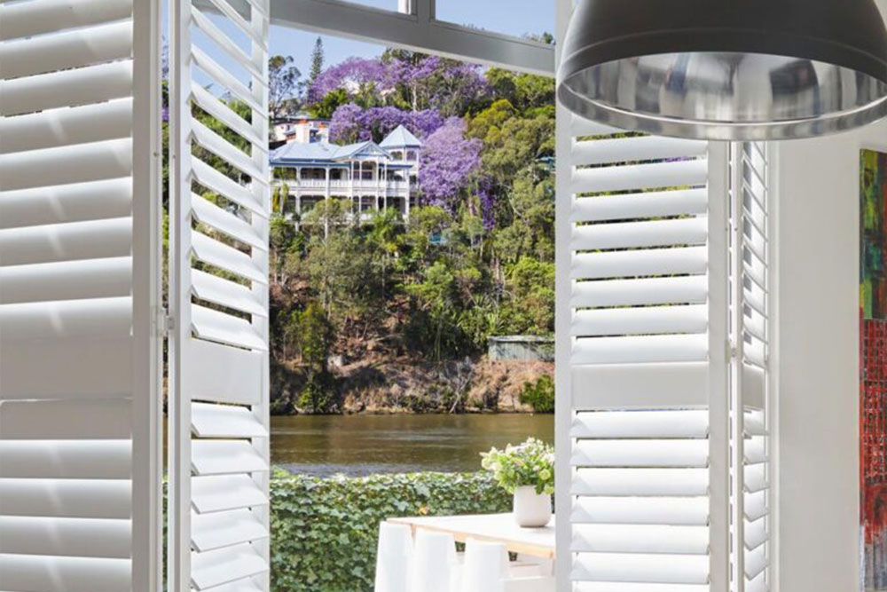 Balcony with Brightwood Module Plantation Shutters — Timber Tec Shutters In Ballina, NSW